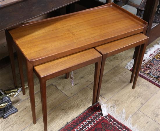 A Danish teak three quarter gallery coffee table and two small table inserts W.80cm